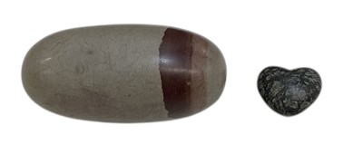 Lot 574 - A small polished Lingam stone, India, with...