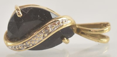 Lot 1301 - A 9ct gold necklace pendant, with claw set cut...