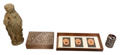 Lot 262 - A 1930s carved oak floral decorated lidded...