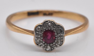 Lot 526 - An 18ct yellow gold ruby and diamond flower...