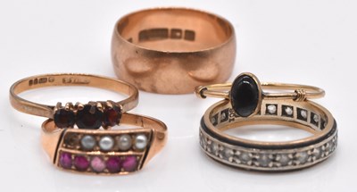 Lot 512 - A 9ct rose gold wedding band, size P, a 9ct...
