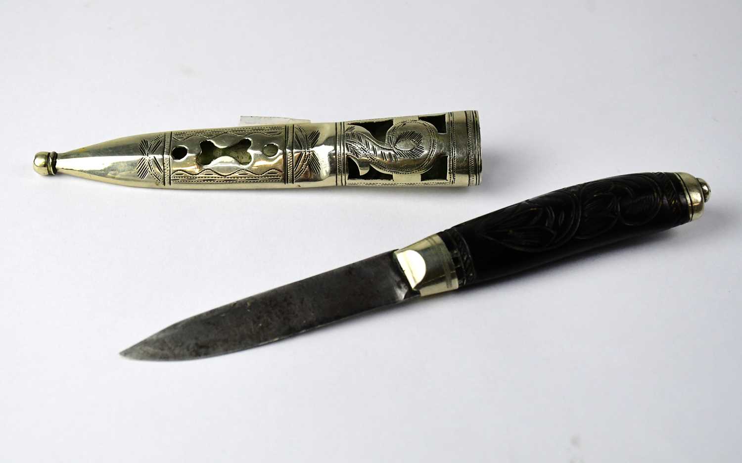 Lot 566 - A Scandinavian puukko knife with carved...