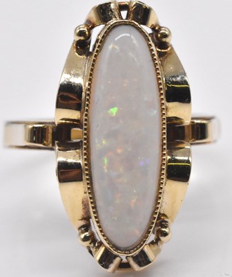 Lot 532 - A yellow metal and opal dress ring, the oval...