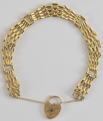 Lot 1341 - A 9ct gold four bar gate bracelet with 9ct...