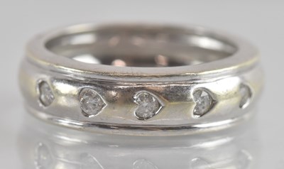 Lot 1233 - A 9ct white gold contemporary half eternity...