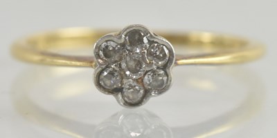 Lot 1252 - An 18ct gold small diamond floral cluster ring,...