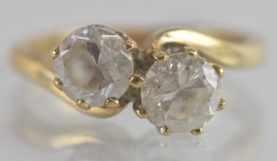 Lot 1263 - A 9ct gold dress ring, with two crossover claw...
