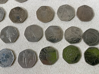 Lot 623 - A group of two pound coins (44), one pound...