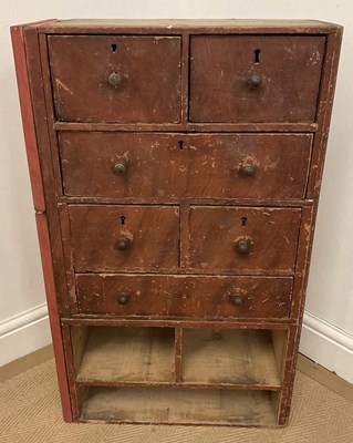 Lot 743 - A stained pine workshop bank of drawers, with...