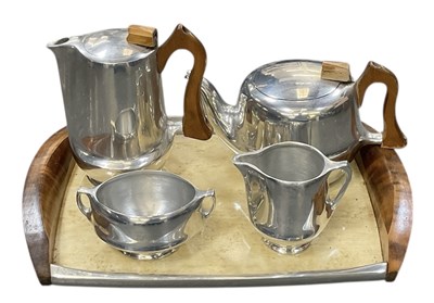 Lot 459 - PICQUOT WARE; a five piece tea set comprising...