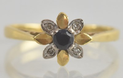 Lot 1248 - An 18ct gold diamond and sapphire set floral...