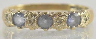 Lot 1236 - A 9ct gold ring set with three cut sapphires...