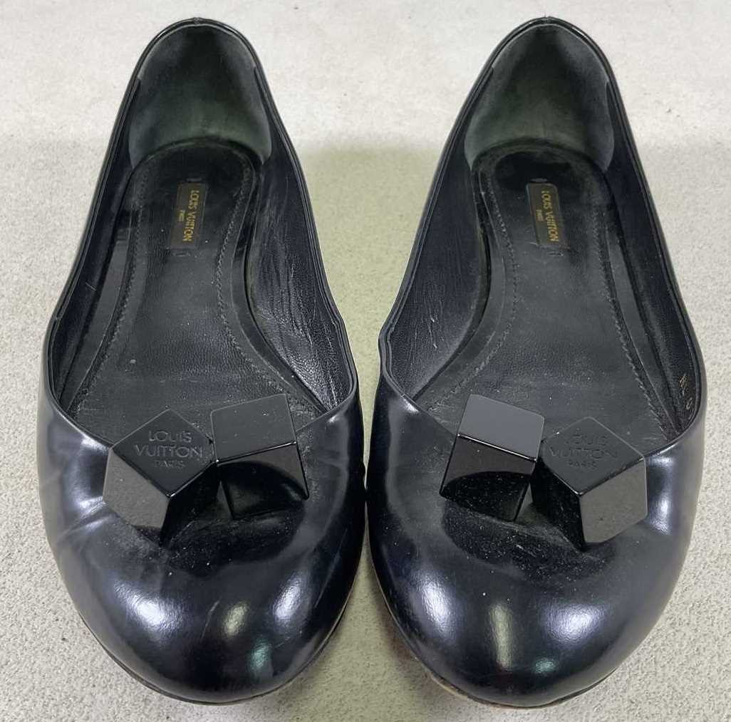 Lot 89 - LOUIS VUITTON; a pair of black dice ballerina...