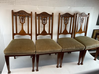 Lot 38 - A set of four carved oak upholstered dining...