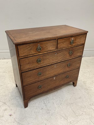 Lot 1151 - An early 19th century mahogany chest, with two...