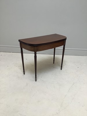 Lot 1258 - An early 19th century mahogany fold-over tea...