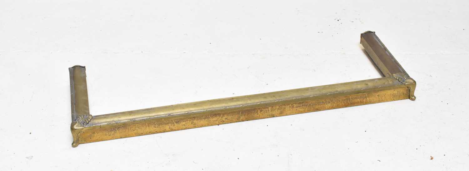 Lot 1579 - An Edwardian brass fire kerb fender, length...