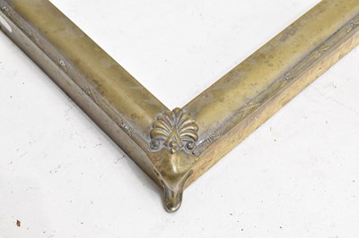 Lot 1579 - An Edwardian brass fire kerb fender, length...