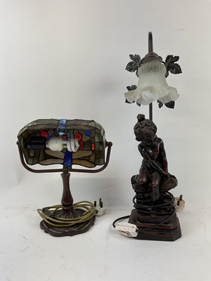 Lot 116 - Two decorative table lamps, one in a Tiffany...