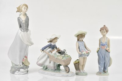 Lot 2479 - LLADRO; four ceramic figures comprising girl...