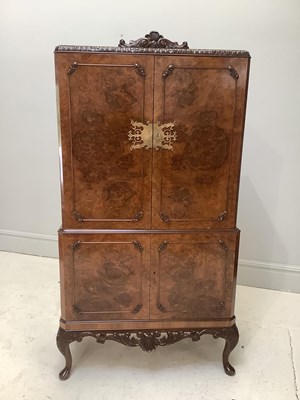 Lot 1182 - A Queen Anne style burr walnut cocktail...