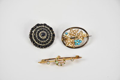 Lot 93 - A Victorian yellow metal opal crescent bar...