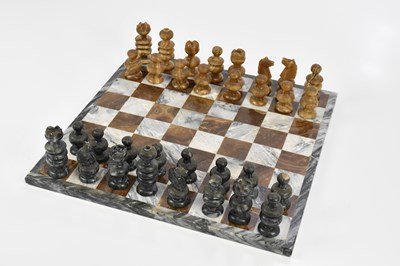 Lot 1487 - An onyx chess set and board, height of king 7cm.