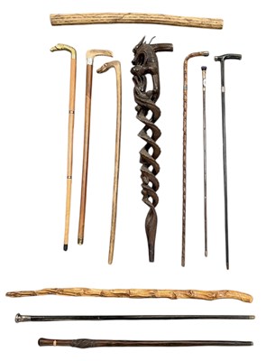 Lot 246 - A collection of eleven assorted walking sticks...