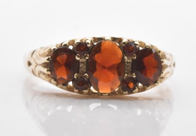 Lot 539 - A 9ct yellow gold garnet set dress ring in the...