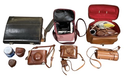Lot 303 - A collection of vintage camera lenses and...
