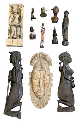 Lot 1063 - A modern relief carved wooden wall hanging...