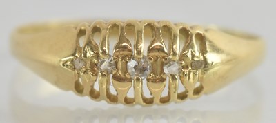 Lot 1229 - An 18ct gold five stone diamond set ring, with...