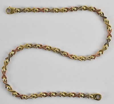 Lot 1269 - A 9ct gold three colour 'X' link necklace,...