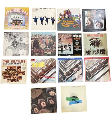 Lot 327 - A collection of fourteen Beatles albums...