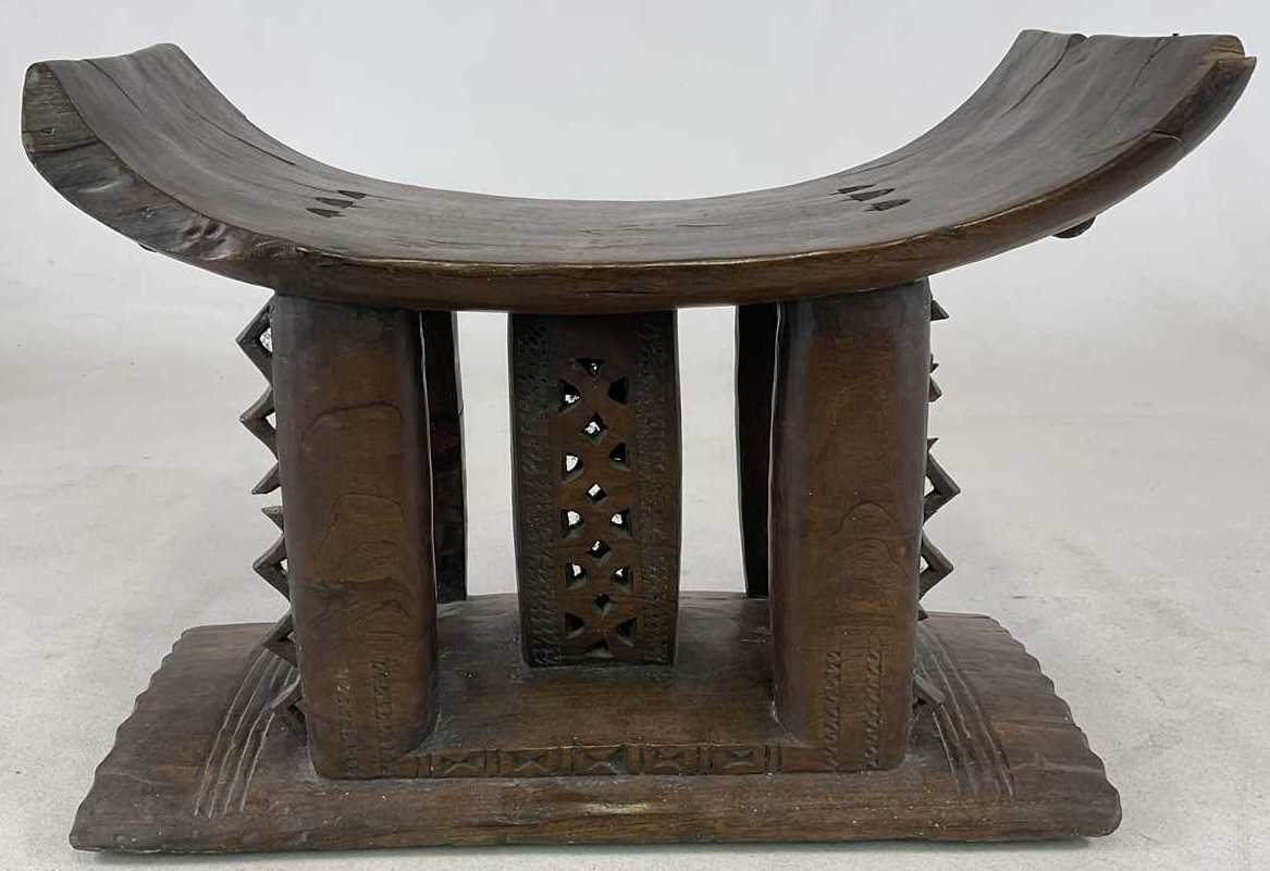 Lot 5 - A Ghanaian Ashanti stool, with typical dished...