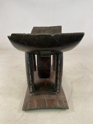 Lot 5 - A Ghanaian Ashanti stool, with typical dished...