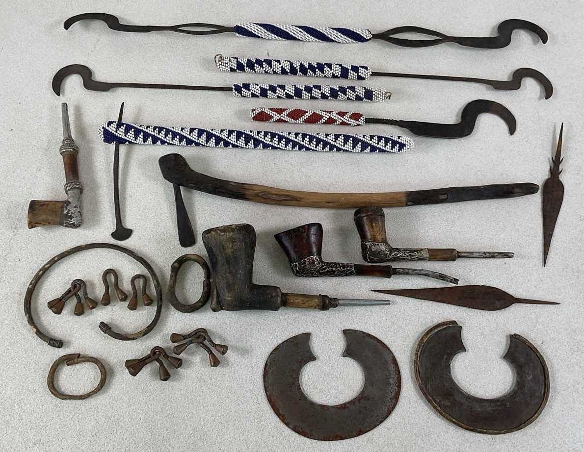 Lot 9 - A group of African tribal tools with bead...