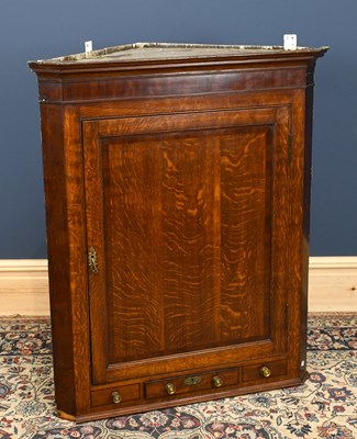 Lot 2877 - A George III oak and mahogany hanging corner...