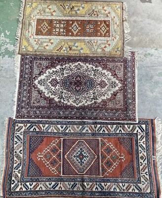 Lot 666 - Three Middle Eastern rugs, largest 172 x 90cm.