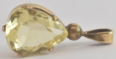 Lot 1300 - A pear shaped cut claw set citrine in a gold...