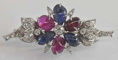 Lot 1320 - A gem set floral brooch, with bezel set...