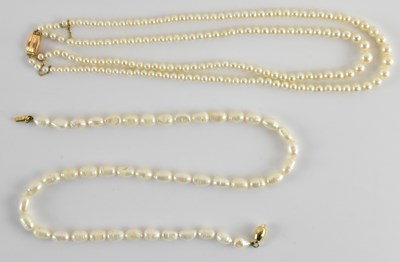 Lot 1295 - Two cultured pearl necklaces comprising a...