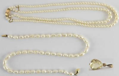 Lot 1440 - A pear shaped cut claw set citrine in a gold...