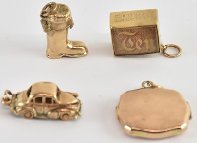 Lot 1199 - Three 9ct gold charms comprising a car, a boot...