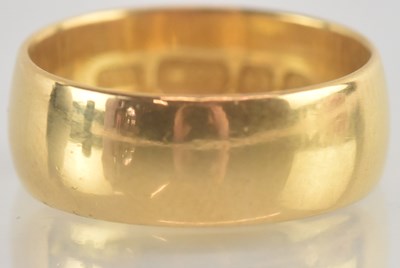 Lot 1211 - A 22ct gold wide wedding ring, size J, approx...