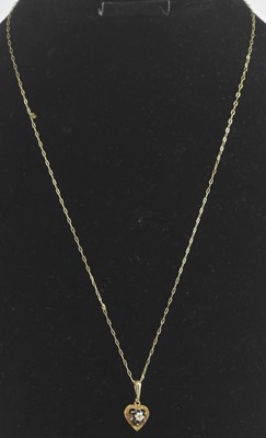 Lot 1454 - A 9ct gold dainty necklace, with a heart...