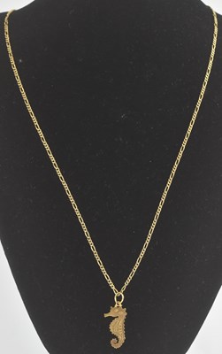 Lot 1279 - A 9ct gold figaro necklace, length 60cm, with...