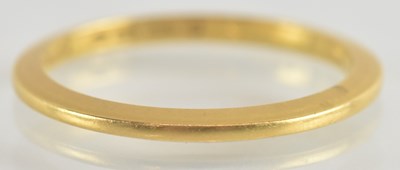 Lot 1256 - A 22ct gold band ring, size J, approx 1.8g.