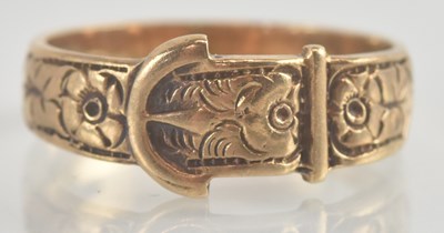 Lot 1255 - A 9ct rose gold buckle ring, size N, approx 3g.