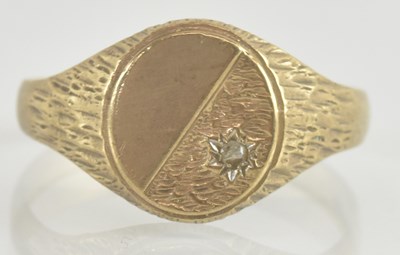 Lot 1253 - A 9ct gold signet ring, with diagonal floral...